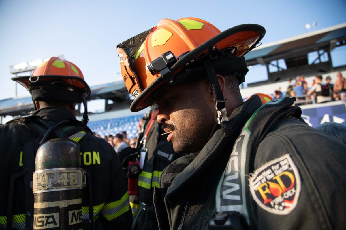 Firefighters enter the stands for the 9/11 Memorial Stair Climb on Wednesday, Sept. 11, 2024, at Kroger Field in Lexington, Kentucky. Photo by Christian Kantosky | Staff