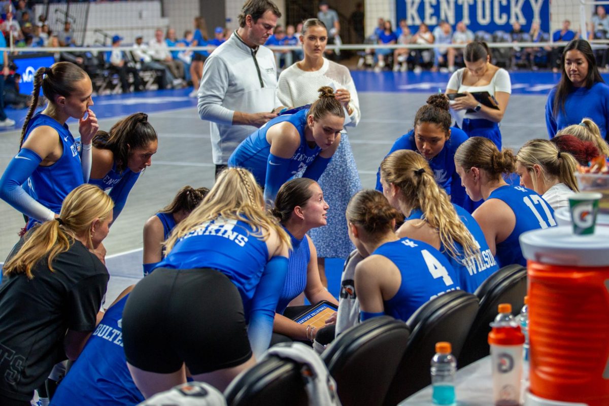 Kentucky Assistant Coach Merideth Jewell talks to the team during a timeout at the Kentucky vs Louisville volleyball game on Wednesday, Sept. 18, 2024, at Memorial Coliseum in Lexington, Kentucky. Kentucky lost 3-1. Photo by Sydney Novack | Staff