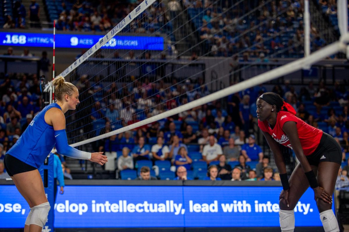 Kentucky Middle Blocker Brooke Bultema and Louisville Middle Blocker Phekran Kong focus on the next point during the Kentucky vs Louisville volleyball game on Wednesday, Sept. 18, 2024, at Memorial Coliseum in Lexington, Kentucky. Kentucky lost 3-1. Photo by Sydney Novack | Staff