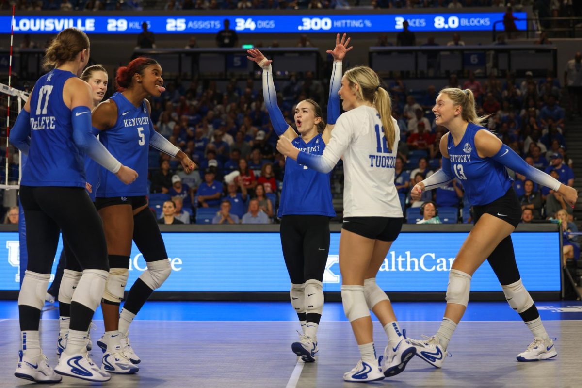 Kentucky celebrates a point during the Kentucky vs. Louisville volleyball game on Wednesday, Sept. 18, 2024, at Memorial Coliseum in Lexington, Kentucky. Kentucky lost 3-1. Photo by Sydney Yonker | Staff