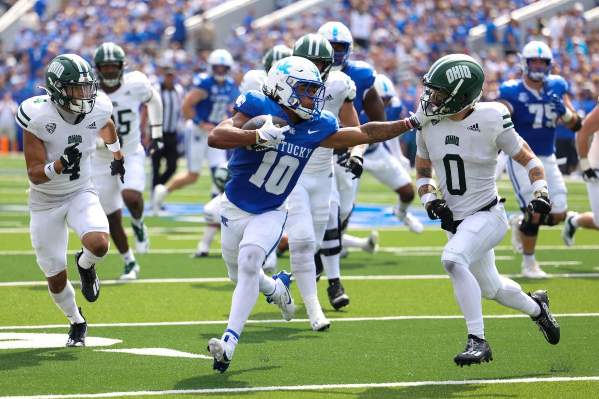 Kentucky Wildcats running back Jamarion Wilcox (10) stiff arms a defender during the Kentucky vs. Ohio University Football game on Saturday, Sept. 21, 2024, at Kroger Field in Lexington, Kentucky. Photo by Sydney Yonker | Staff