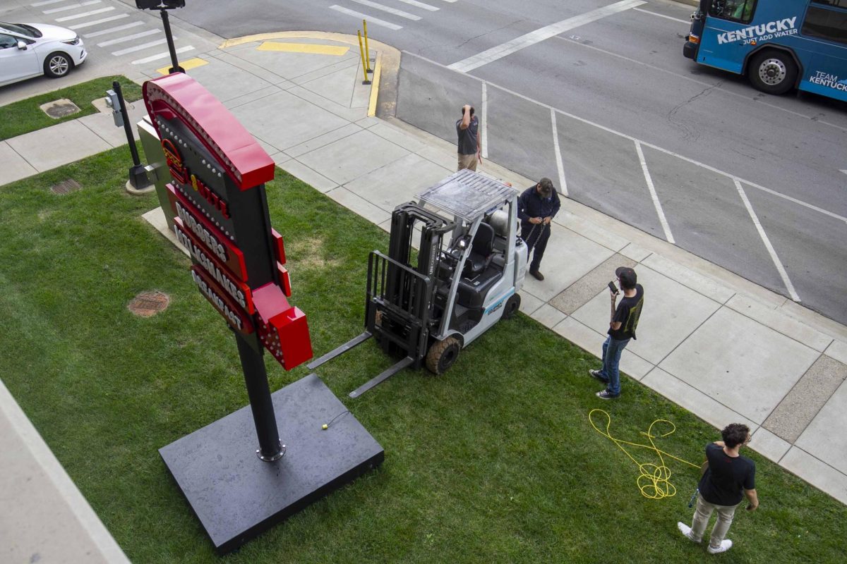 L8nite employees wait for help getting their forklift out of the mud on Wednesday, Sept. 4, 2024, at the University of Kentucky in Lexington, Kentucky. Photo by Matthew Mueller | Staff