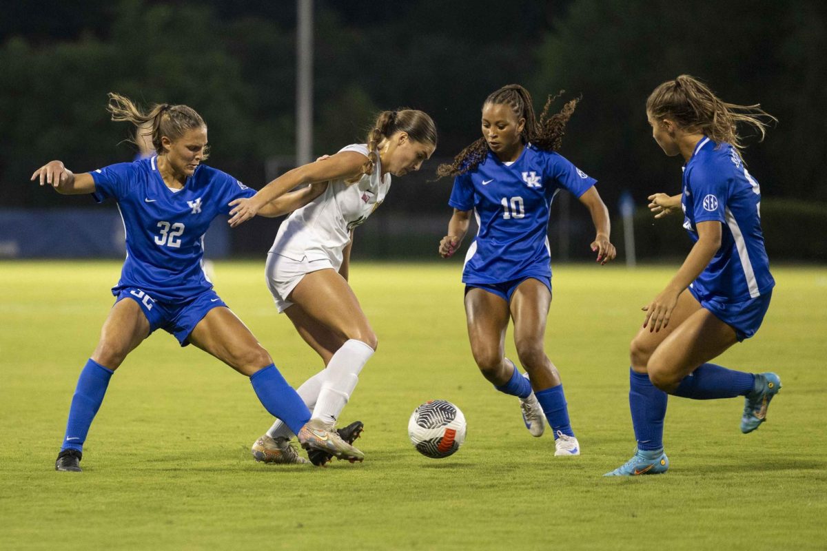 Kentucky players swarm a Murray State player trying to get possession of the ball during the Kentucky vs Murray State Soccer match on Thursday, Sept. 5, 2024, at Wendell & Vickie Bell Soccer Complex in Lexington, Kentucky. Kentucky defeated Murray State 1-0. Photo by Matthew Mueller | Photo Editor