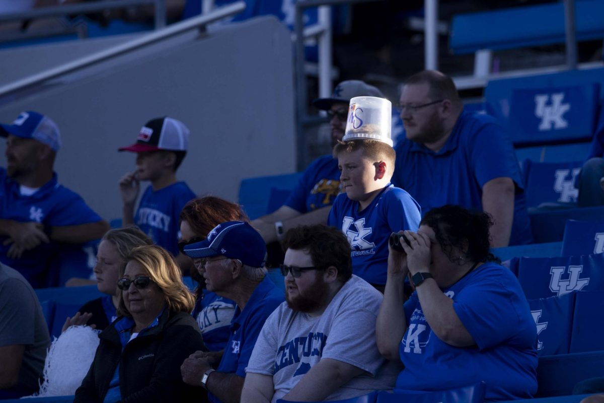 A fan sits with a popcorn bucked on hjs head during the game between Kentucky and South Carolina. Kentucky lost to South Carolina 31-6. Saturday, Sept. 7, 2024, at Kroger Field in Lexington, Kentucky. Photo by Matthew Mueller | Photo Editor