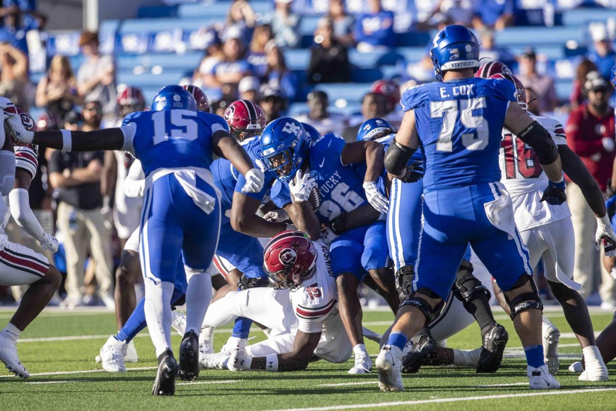 Kentucky Wildcats running back Jason Patterson (26) tries to push past defenders during the game between Kentucky and South Carolina. Kentucky lost to South Carolina 31-6. Saturday, Sept. 7, 2024, at Kroger Field in Lexington, Kentucky. Photo by Matthew Mueller | Photo Editor