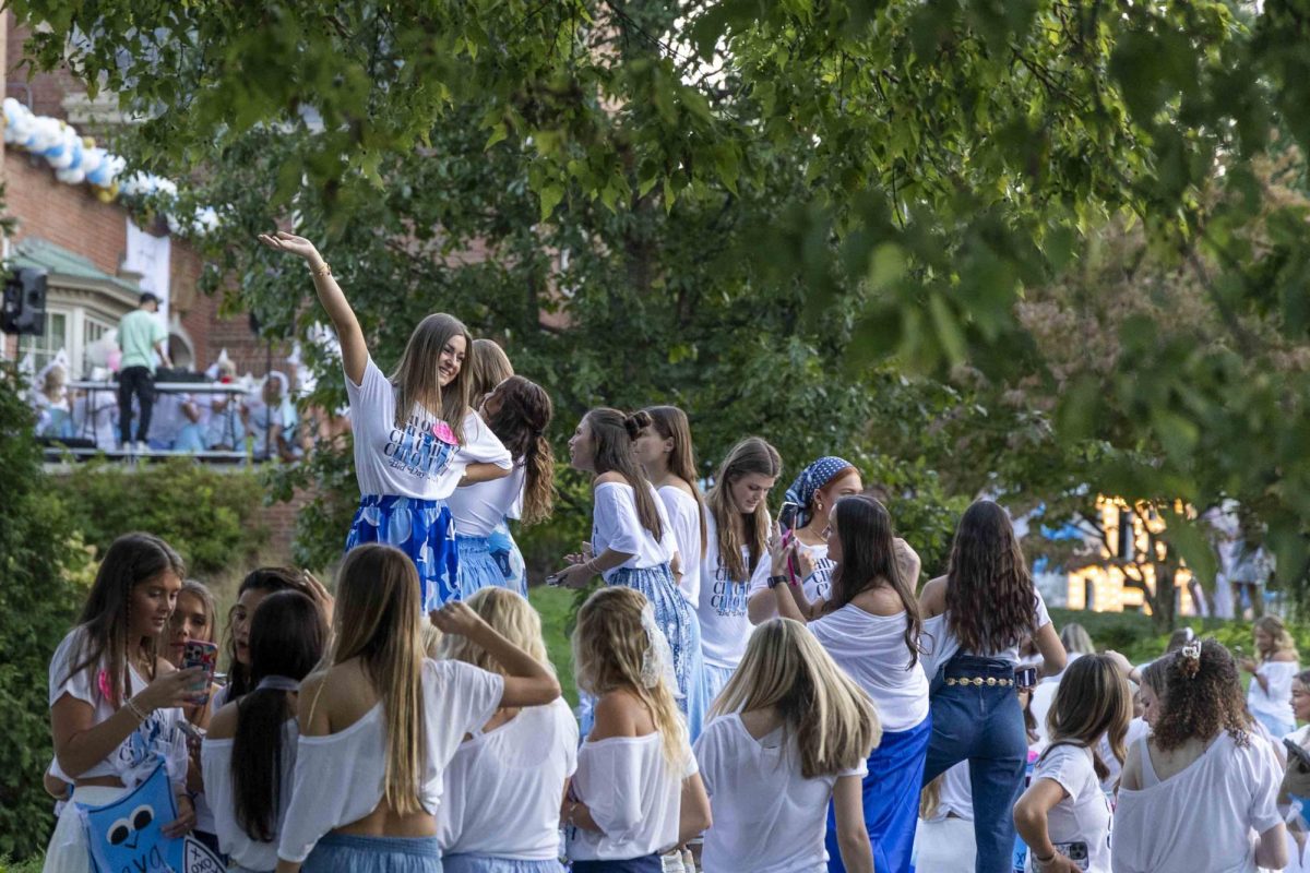 Member of Chi Omega poses for a photo during bid day on Monday, Sept. 9, 2024, at Greek Row in Lexington, Kentucky. Photo by Matthew Mueller | Staff