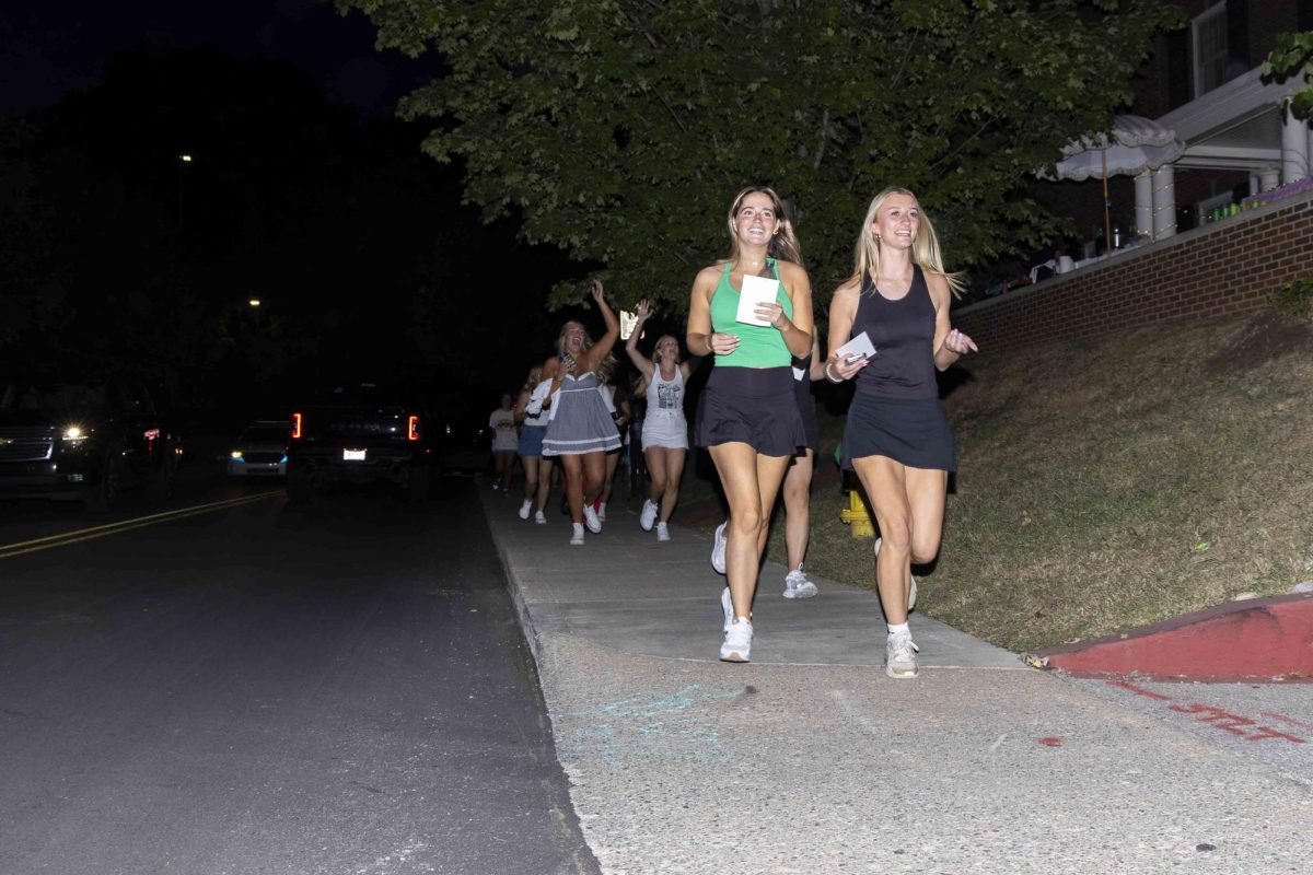 New sorority members run to their new houses during bid day on Monday, Sept. 9, 2024, at Greek Row in Lexington, Kentucky. Photo by Matthew Mueller | Staff