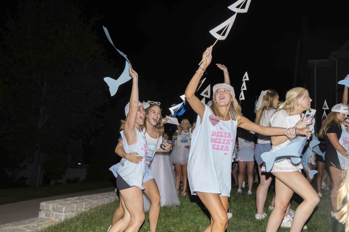 Members of Delta Delta Delta cheer as new members arrive at their house during bid day on Monday, Sept. 9, 2024, at Greek Row in Lexington, Kentucky. Photo by Matthew Mueller | Staff