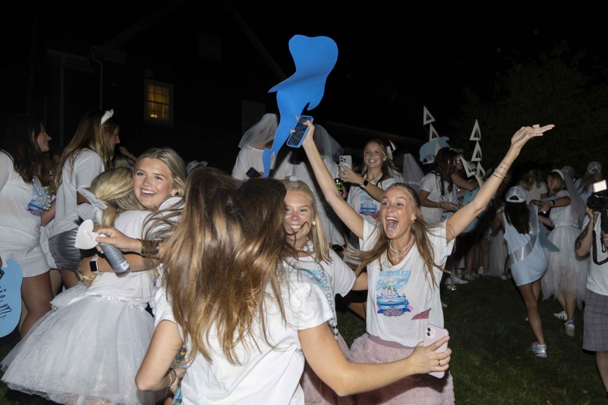 Members of Delta Delta Delta cheer as new members arrive at their house during bid day on Monday, Sept. 9, 2024, at Greek Row in Lexington, Kentucky. Photo by Matthew Mueller | Staff