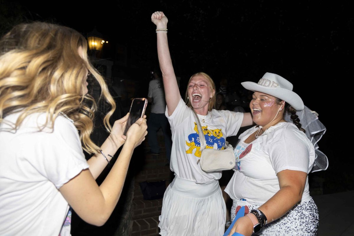 Members of Delta Delta Delta cheer as new members arrive at their house during bid day on Monday, Sept. 9, 2024, at Greek Row in Lexington, Kentucky. Photo by Matthew Mueller | Staff