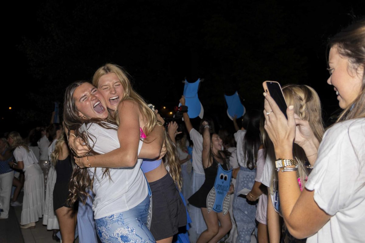 New members of Delta Delta Delta hug as they arrive at their house during bid day on Monday, Sept. 9, 2024, at Greek Row in Lexington, Kentucky. Photo by Matthew Mueller | Staff