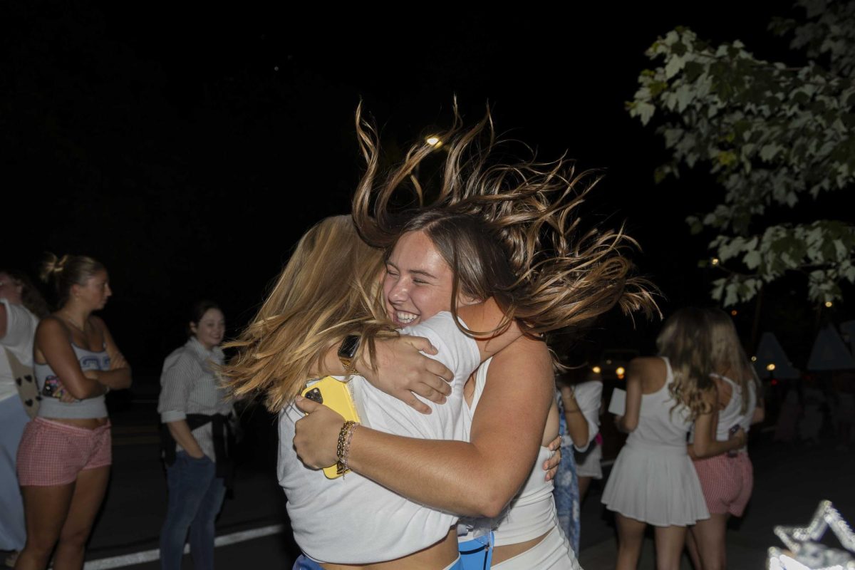 New members of Delta Delta Delta hug as they arrive at their house during bid day on Monday, Sept. 9, 2024, at Greek Row in Lexington, Kentucky. Photo by Matthew Mueller | Staff