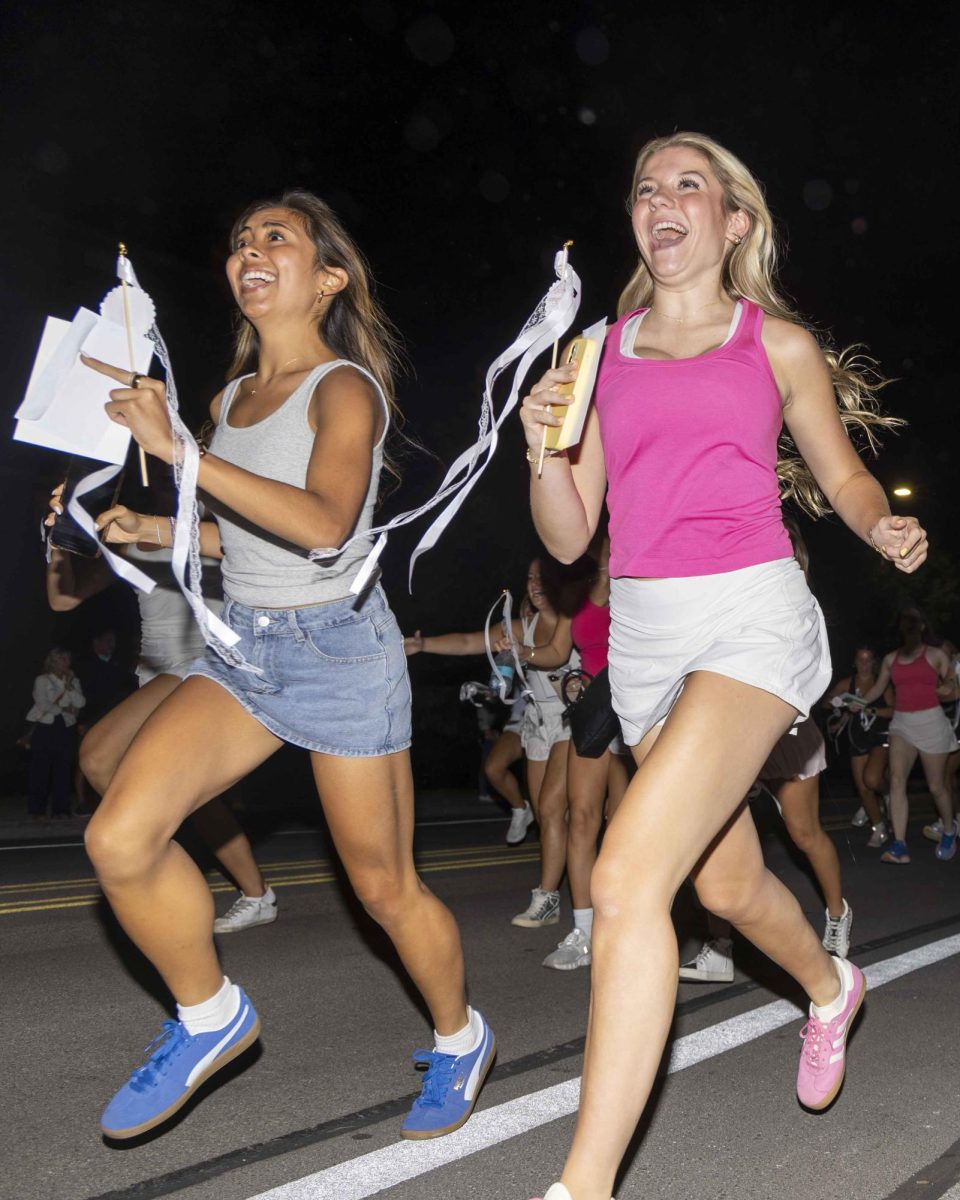 New sorority members run to their new houses during bid day on Monday, Sept. 9, 2024, at Greek Row in Lexington, Kentucky. Photo by Matthew Mueller | Staff