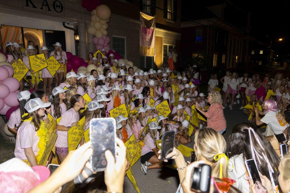 Members of Alpha Chi Omega pose for a photo during bid day on Monday, Sept. 9, 2024, at Greek Row in Lexington, Kentucky. Photo by Matthew Mueller | Staff