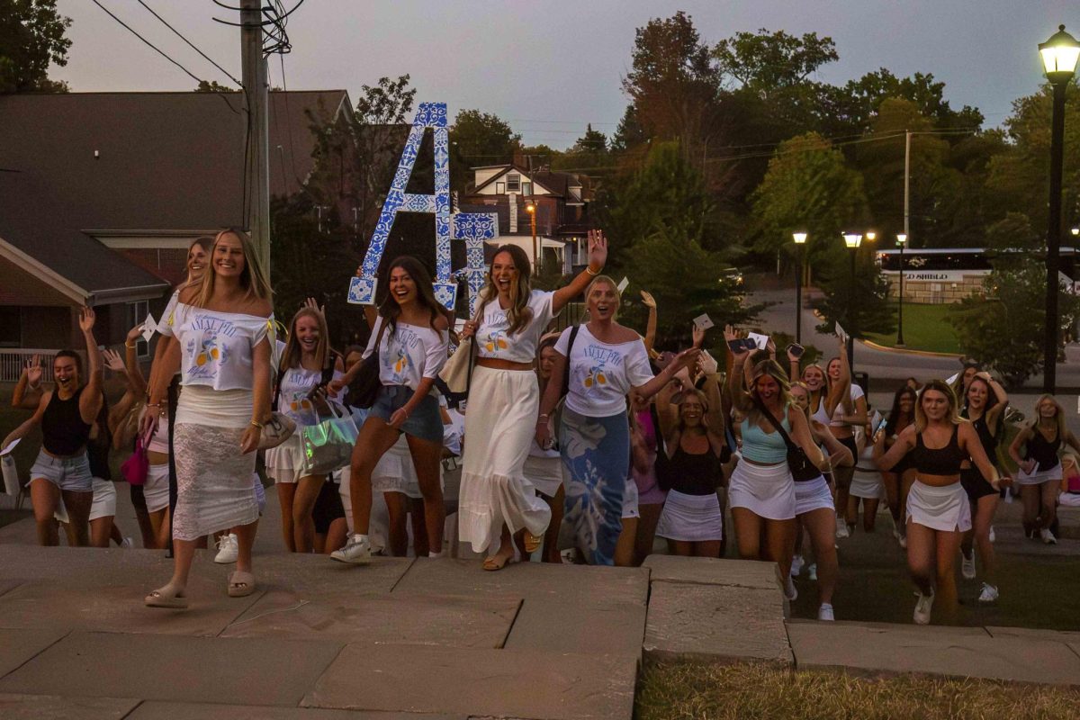 Members of Alpha Phi lead their new members to the Alpha Phi house during Sorority Bid Day on Monday, Sep 10, 2024. Photo by Sydney Novack | staff