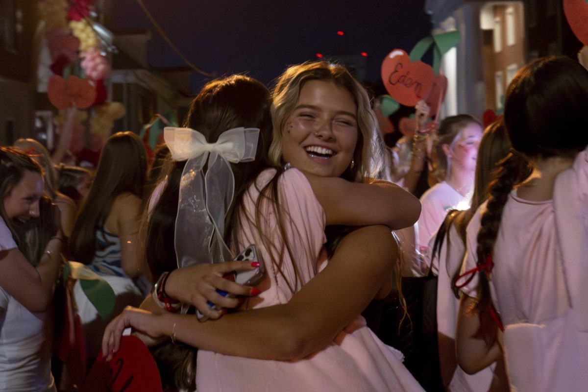 Alpha Chi Omega member embraces a new member during Sorority Bid Day on Monday, Sept. 9, 2024, at Greek Row in Lexington, Kentucky. Photo by Sydney Novack | staff