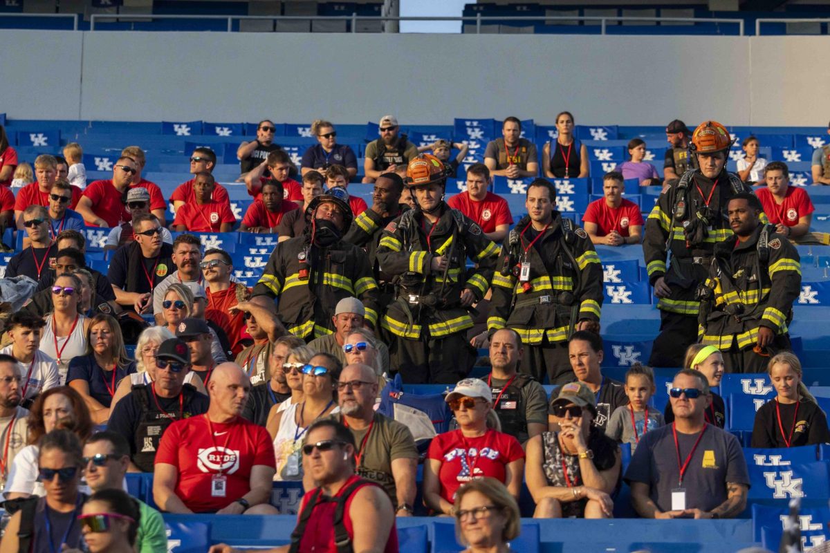 Firefighters listen to instructions while waiting fro the climb to start during the 9/11 Memorial Stair Climb on Wednesday, Sept. 11, 2024, at Kroger Field in Lexington, Kentucky. Photo by Matthew Mueller | Staff