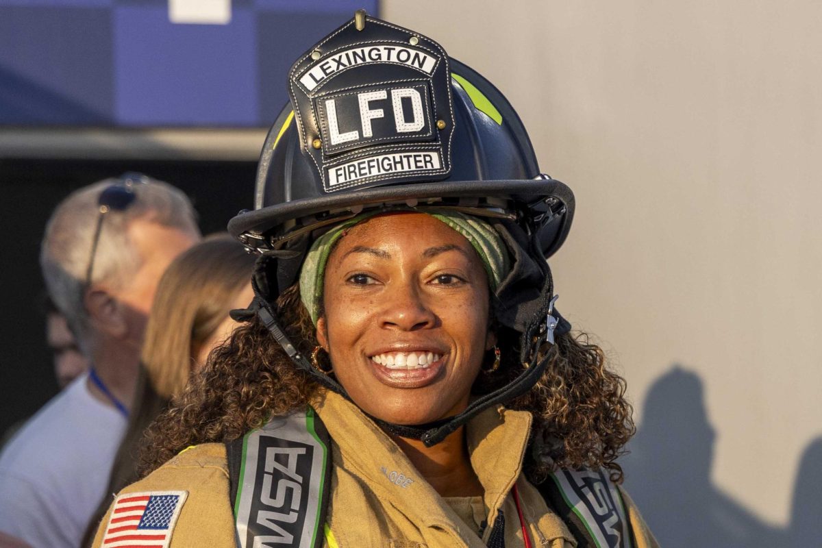 A firefighter smiles as she enters the stadium before the 9/11 Memorial Stair Climb on Wednesday, Sept. 11, 2024, at Kroger Field in Lexington, Kentucky. Photo by Matthew Mueller | Staff