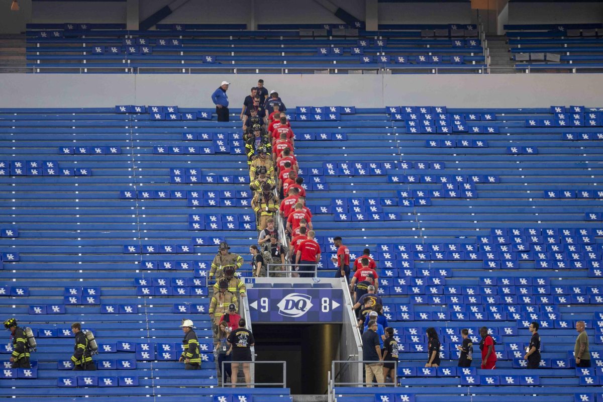 Community members and firefighters participate in the 9/11 Memorial Stair Climb on Wednesday, Sept. 11, 2024, at Kroger Field in Lexington, Kentucky. Photo by Matthew Mueller | Staff