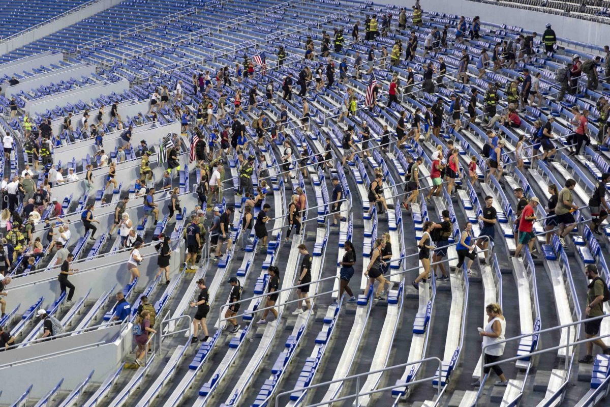 Community members and firefighters participate in the 9/11 Memorial Stair Climb on Wednesday, Sept. 11, 2024, at Kroger Field in Lexington, Kentucky. Photo by Matthew Mueller | Staff