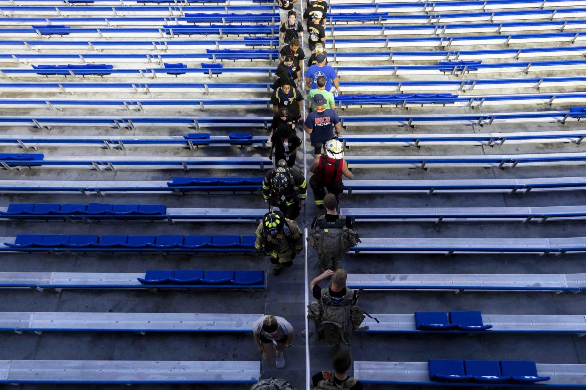 Community members and firefighters participate in the 9/11 Memorial Stair Climb on Wednesday, Sept. 11, 2024, at Kroger Field in Lexington, Kentucky. Photo by Matthew Mueller | Staff