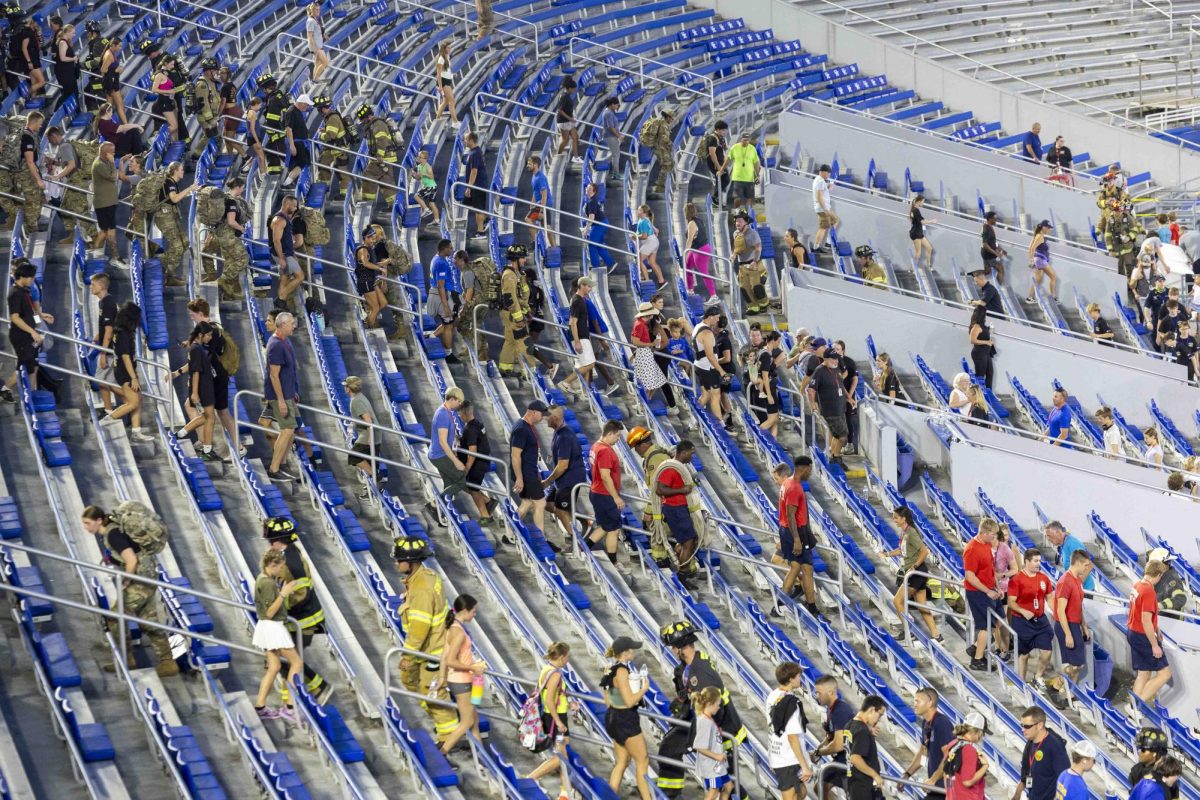 Community members and firefighters participate in the 9/11 Memorial Stair Climb on Wednesday, Sept. 11, 2024, at Kroger Field in Lexington, Kentucky. Photo by Matthew Mueller | Staff