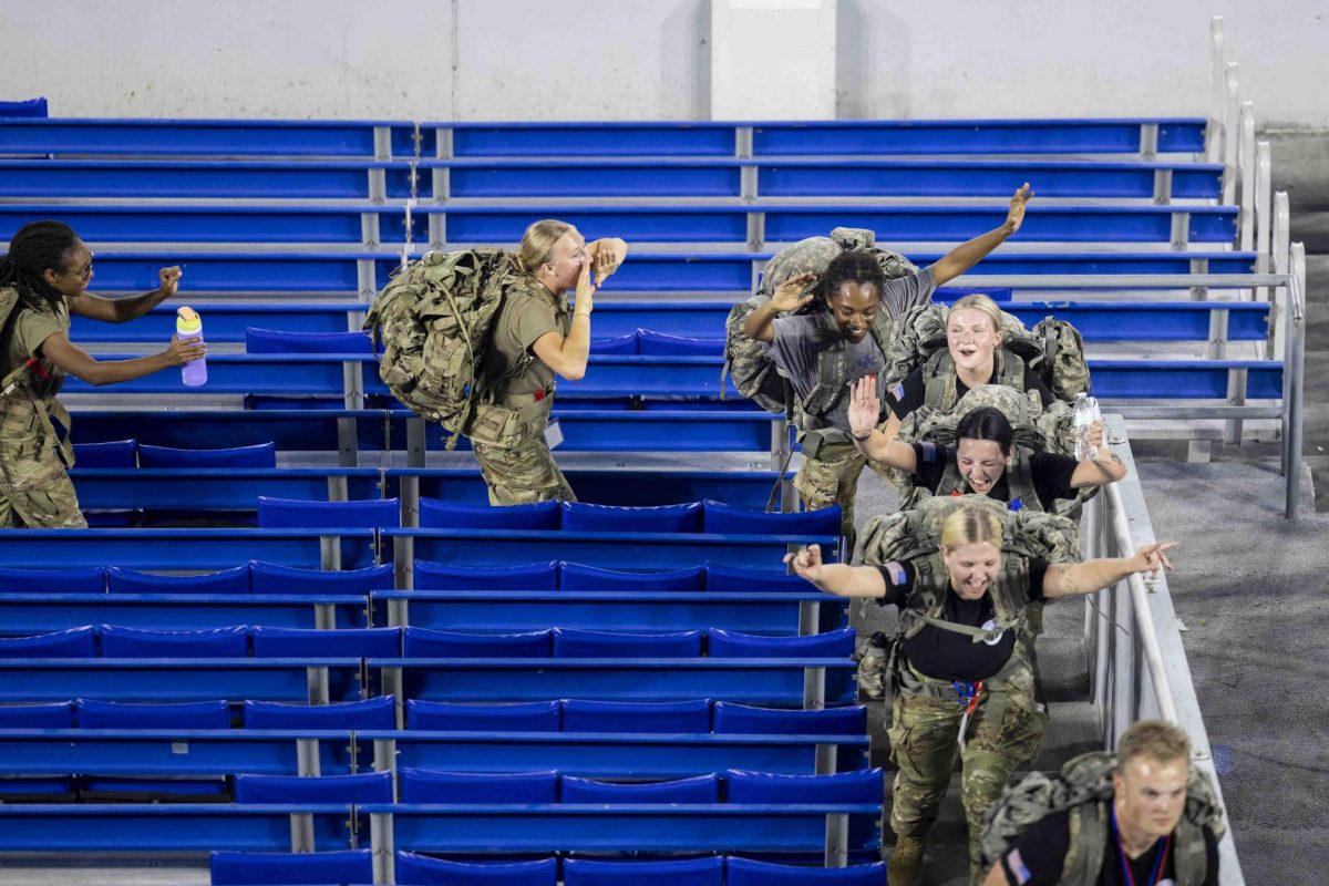 University of Kentucky ROTC sings along to music playing during the 9/11 Memorial Stair Climb on Wednesday, Sept. 11, 2024, at Kroger Field in Lexington, Kentucky. Photo by Matthew Mueller | Staff