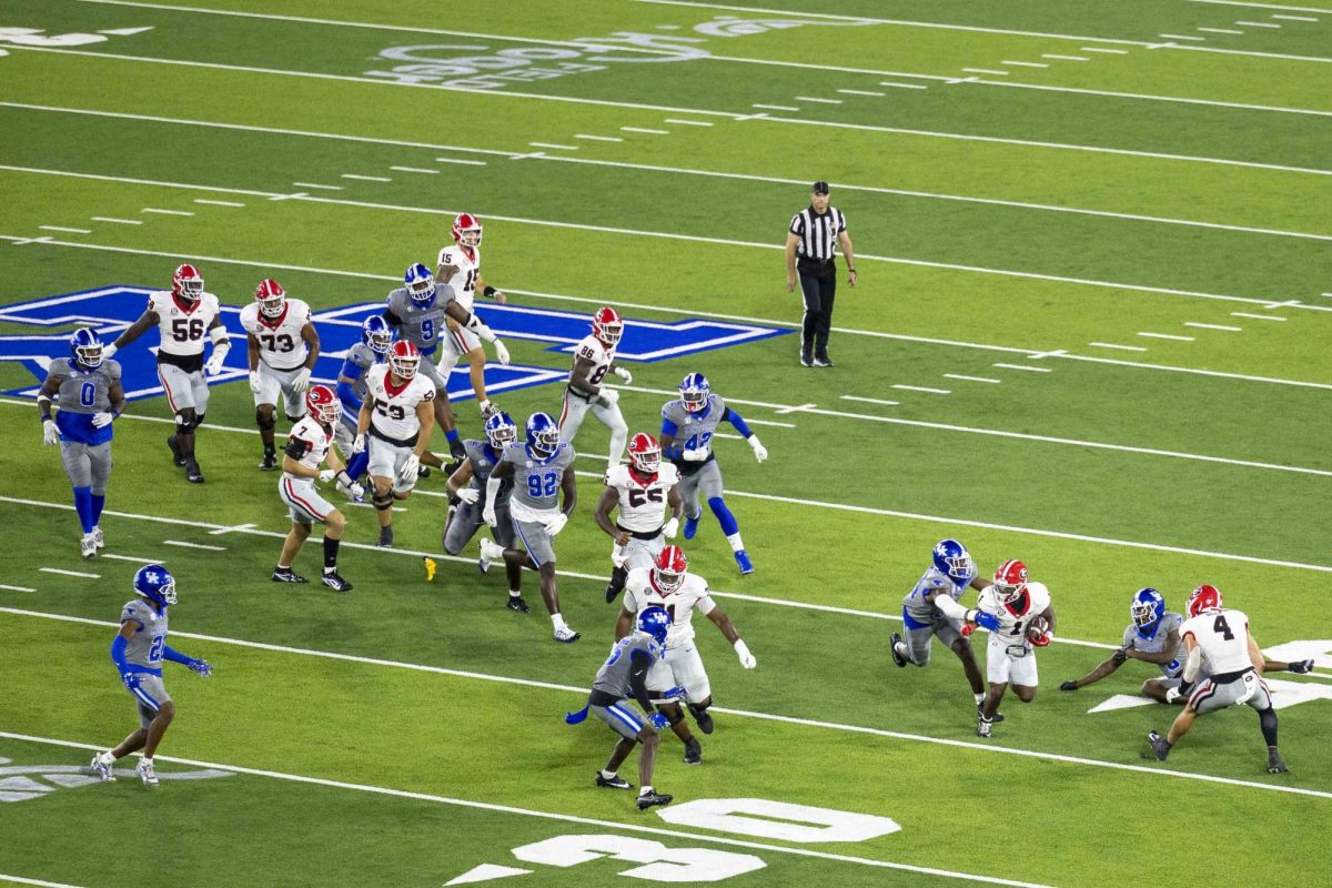 Georgia Bulldogs running back Trevor Etienne (1) runs past defenders during the game between Kentucky and Georgia on Saturday, Sept. 14, 2024, at Kroger Field in Lexington, Kentucky. Kentucky lost to Georgia 13-12. Photo by Matthew Mueller | Staff