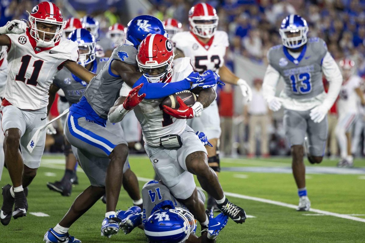 Georgia Bulldogs running back Trevor Etienne (1) tries to push past defenders during the game between Kentucky and Georgia on Saturday, Sept. 14, 2024, at Kroger Field in Lexington, Kentucky. Kentucky lost to Georgia 13-12. Photo by Matthew Mueller | Staff