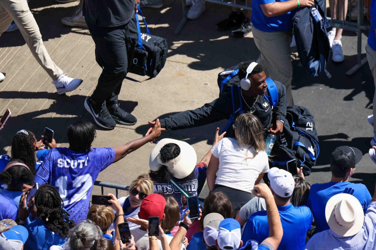 Kentucky defensive back Quay’ sheed Scott high fives fans during the cat walk on Saturday, Sept. 7, 2024, at Kroger Field in Lexington, Kentucky. Photo by Sydney Yonker | Staff