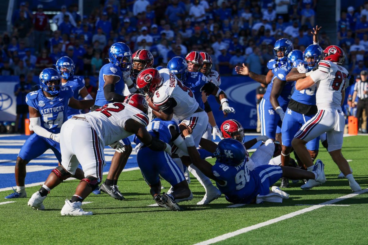 Kentucky defensive lineman Trevon Rybka and defensive tackle Deone Walker go for the tackle during the Kentucky vs Southern Carolina football game on Saturday, Sept. 7, 2024, at Kroger Field in Lexington Kentucky. Kentucky lost 31-6. Photo by Sydney Yonker | Staff