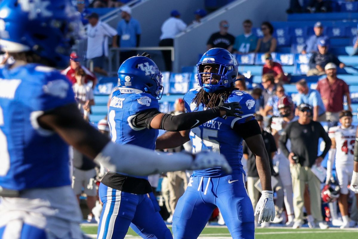 Kentucky outside linebacker Steven Soles Jr. and defensive back Zion Childress celebrate a stop during the Kentucky vs Southern Carolina football game on Saturday, Sept. 7, 2024, at Kroger Field in Lexington Kentucky. Kentucky lost 31-6. Photo by Sydney Yonker | Staff