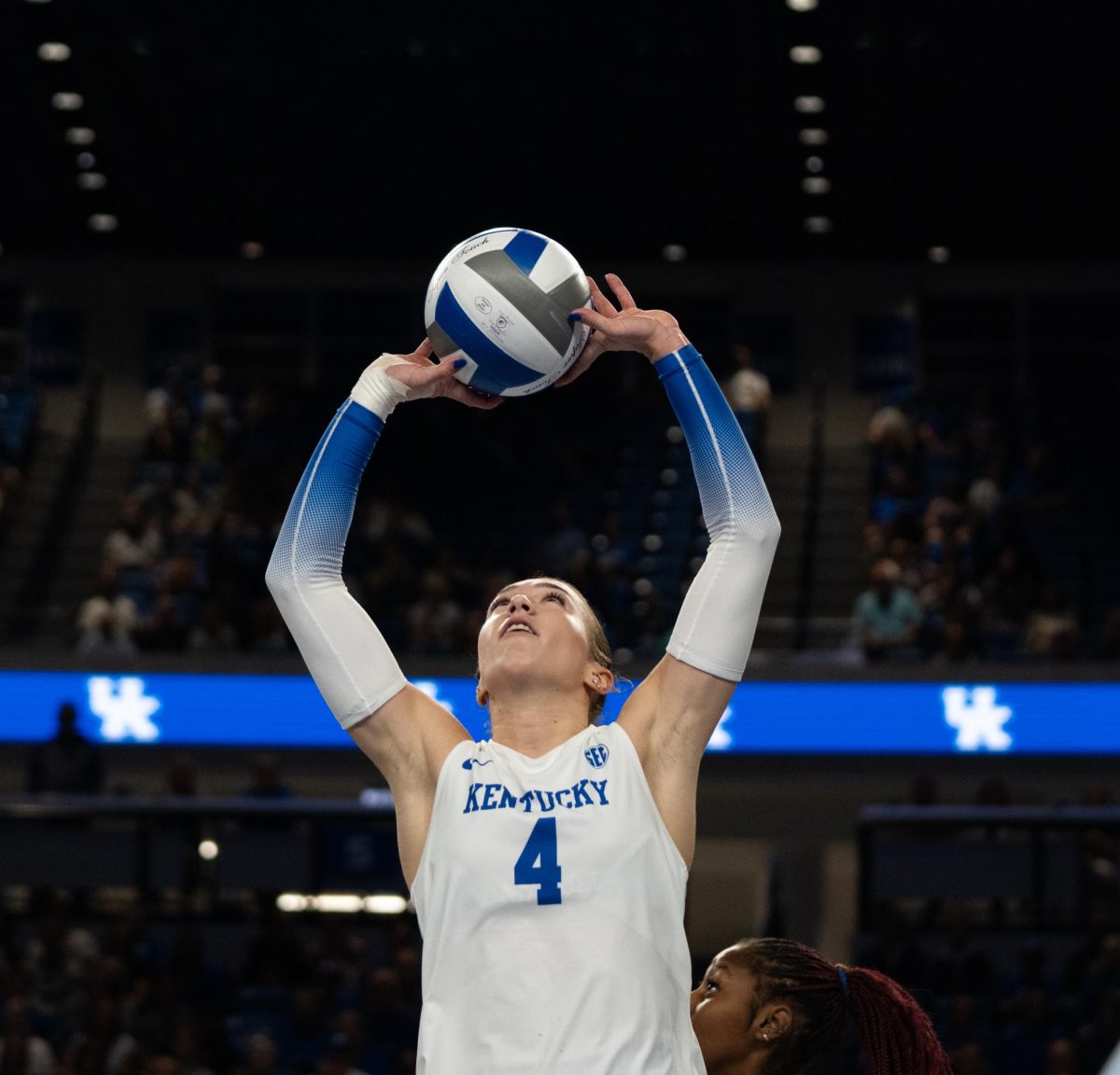 Kentucky setter Emma Grove (4) sets the ball during the No. 9 Kentucky vs. No. 7 Penn State women's volleyball match on Friday, Sept. 6, 2024, at Memorial Coliseum in Lexington, Kentucky. Kentucky lost 2-3. Photo by Brayden Finn | Staff