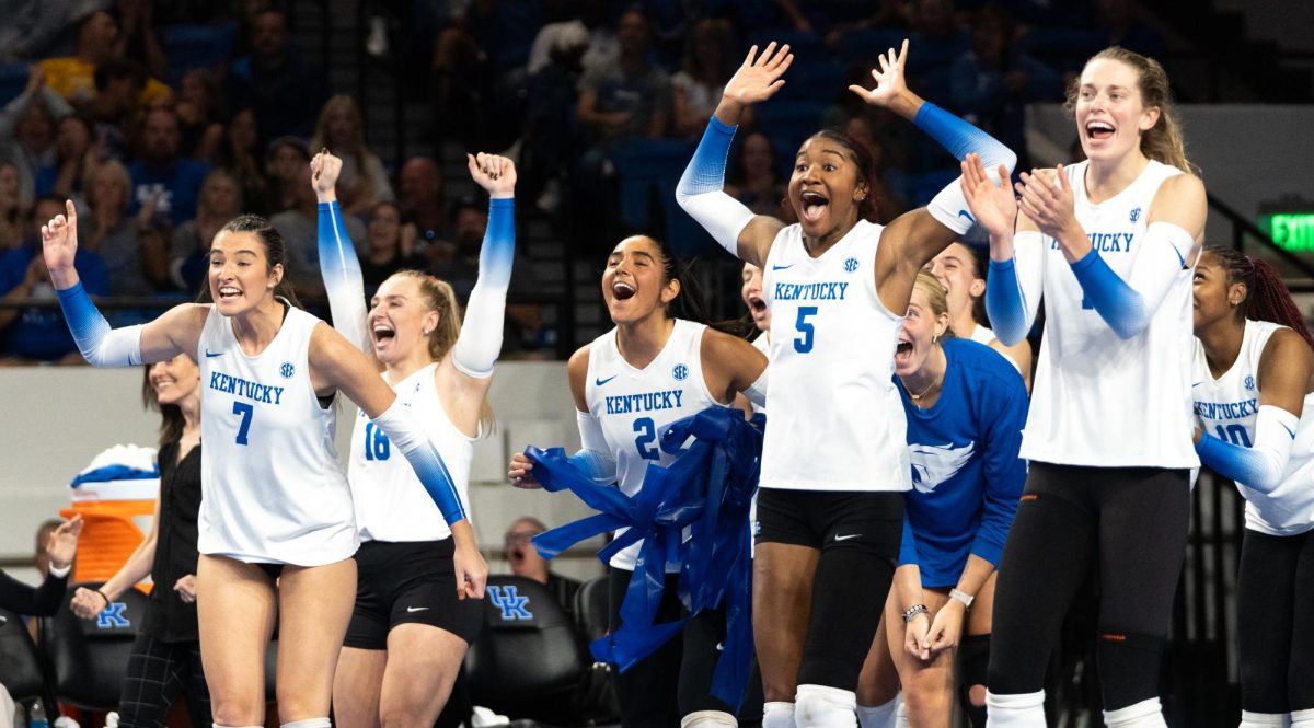 The Kentucky bench celebrates after a point score during the No. 9 Kentucky vs. No. 7 Penn State women's volleyball match on Friday, Sept. 6, 2024, at Memorial Coliseum in Lexington, Kentucky. Kentucky lost 2-3. Photo by Brayden Finn | Staff