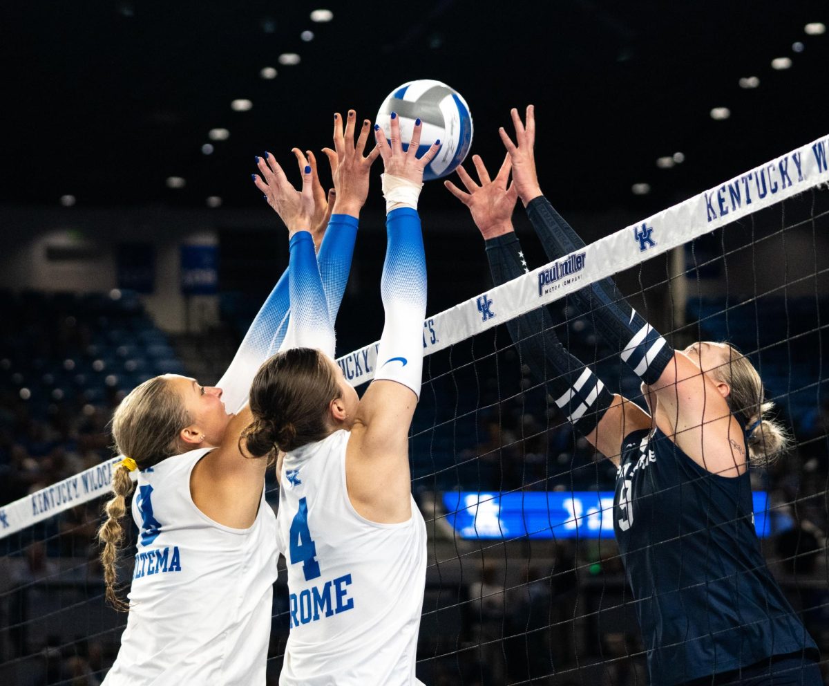 Kentucky players block the ball during the No. 9 Kentucky vs. No. 7 Penn State women's volleyball match on Friday, Sept. 6, 2024, at Memorial Coliseum in Lexington, Kentucky. Kentucky lost 2-3. Photo by Brayden Finn | Staff