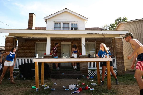 UK students Ella Monnin, Mason Duncan and Jacob Lane play Die before the Kentucky vs. Georgia football game at a day party on Saturday, Sept. 14, 2024, on University Ave. in Lexington, Kentucky. Photo by Abbey Cutrer | Staff