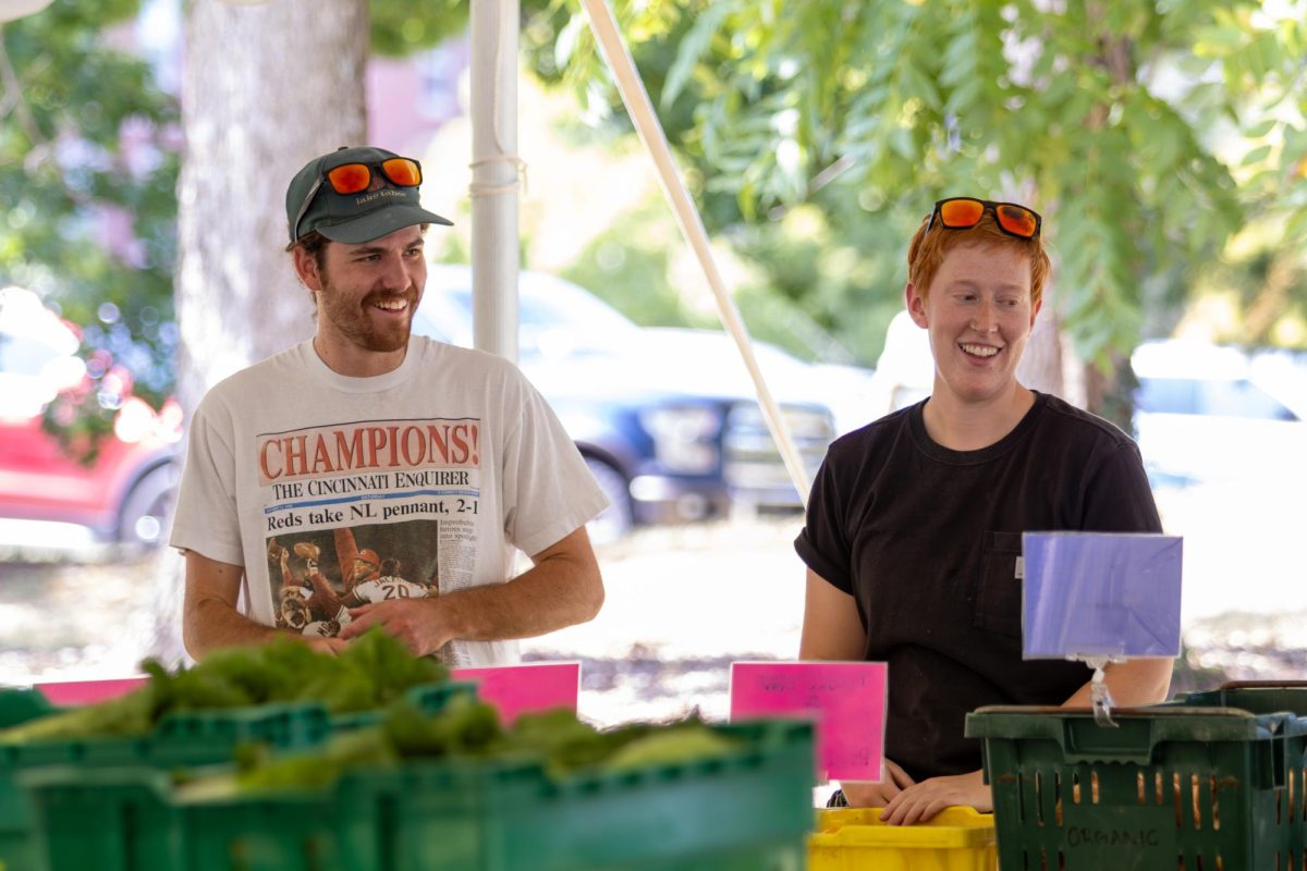 Ben Morrison a senior in Forestry, smiles with his friend Natalie Warren while working for the Wildcat Market at the University of Kentucky on Wednesday, Sep 11, 2024. Photo by Sydney Novack | staff