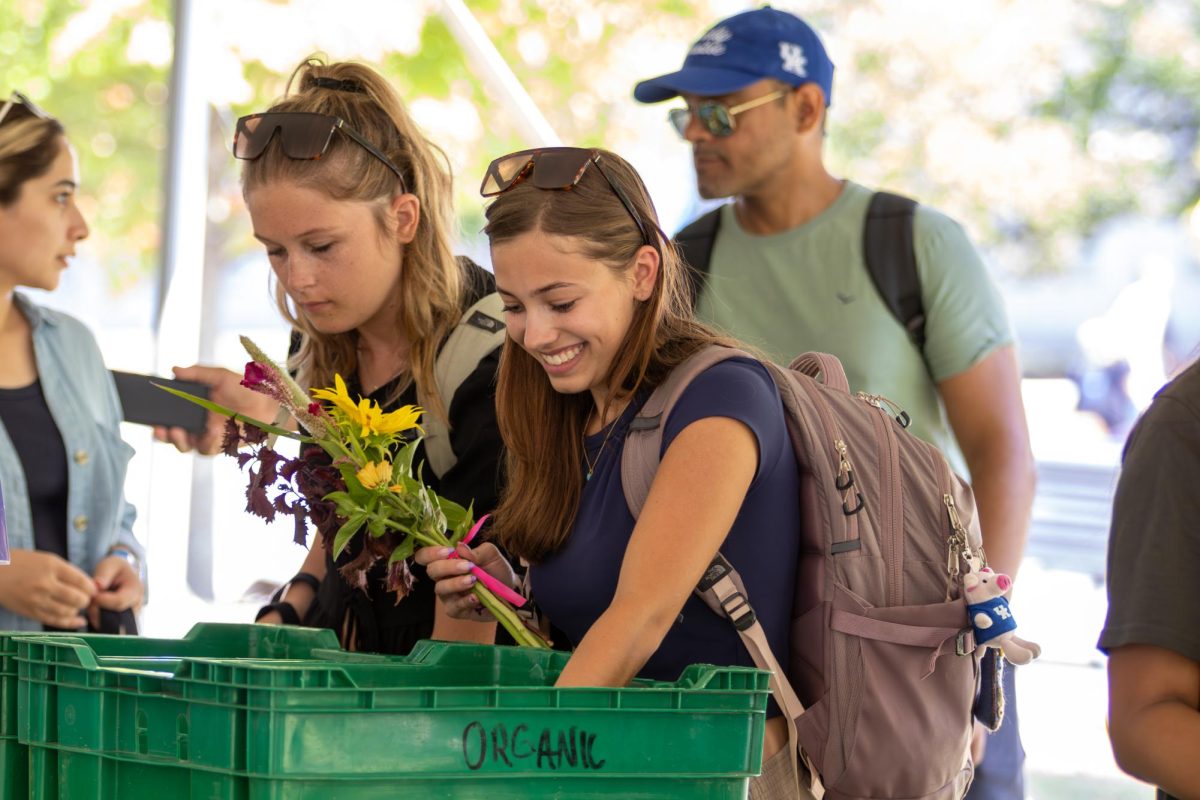 Students line up for fresh food and flowers at Wildcat Market