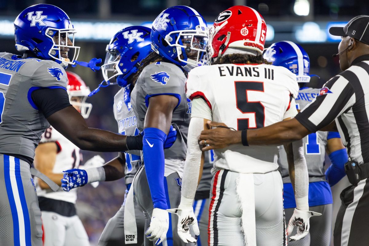 Kentucky defensive back Maxwell Hairston (1), left, and Georgia wide receiver Anthony Evans III (5) are held back from each other during the Kentucky vs. No. 1 Georgia football game on Saturday, Sept. 14, 2024, at Kroger Field in Lexington, Kentucky. Kentucky lost 13-12. Photo by Samuel Colmar | Staff