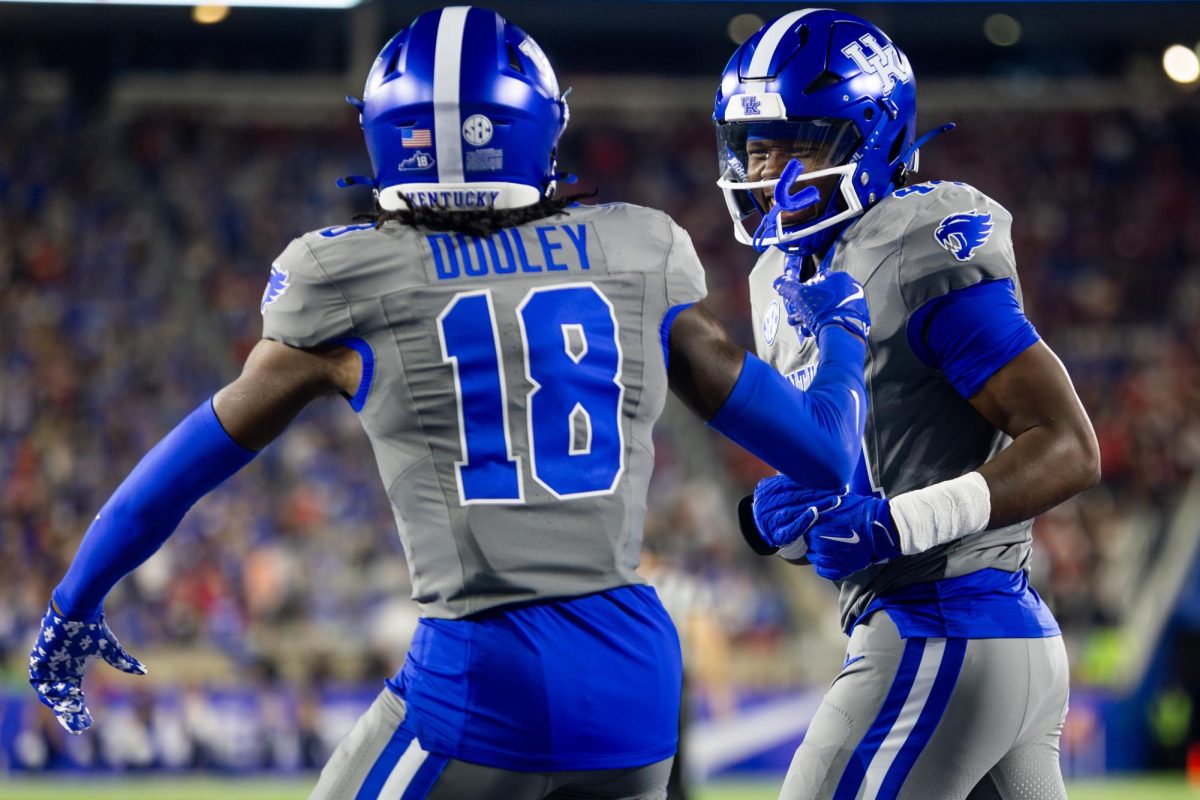 Kentucky defensive back Cam Dooley (18), left, and inside linebacker Antwan Smith (44) celebrate as they head to the locker room at half during the Kentucky vs. No. 1 Georgia football game on Saturday, Sept. 14, 2024, at Kroger Field in Lexington, Kentucky. Kentucky lost 13-12. Photo by Samuel Colmar | Staff