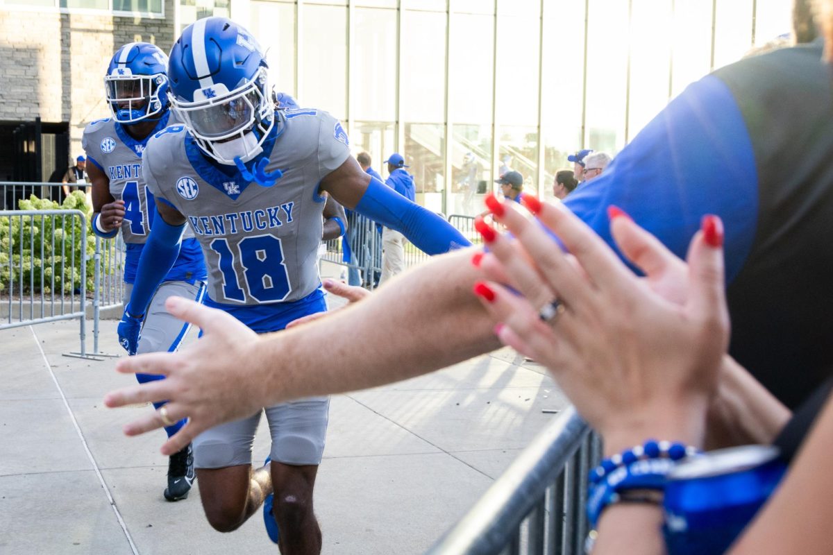 A Kentucky player high-fives fans during the Kentucky vs. No. 1 Georgia football game on Saturday, Sept. 14, 2024, at Kroger Field in Lexington, Kentucky. Kentucky lost 13-12. Photo by Samuel Colmar | Staff