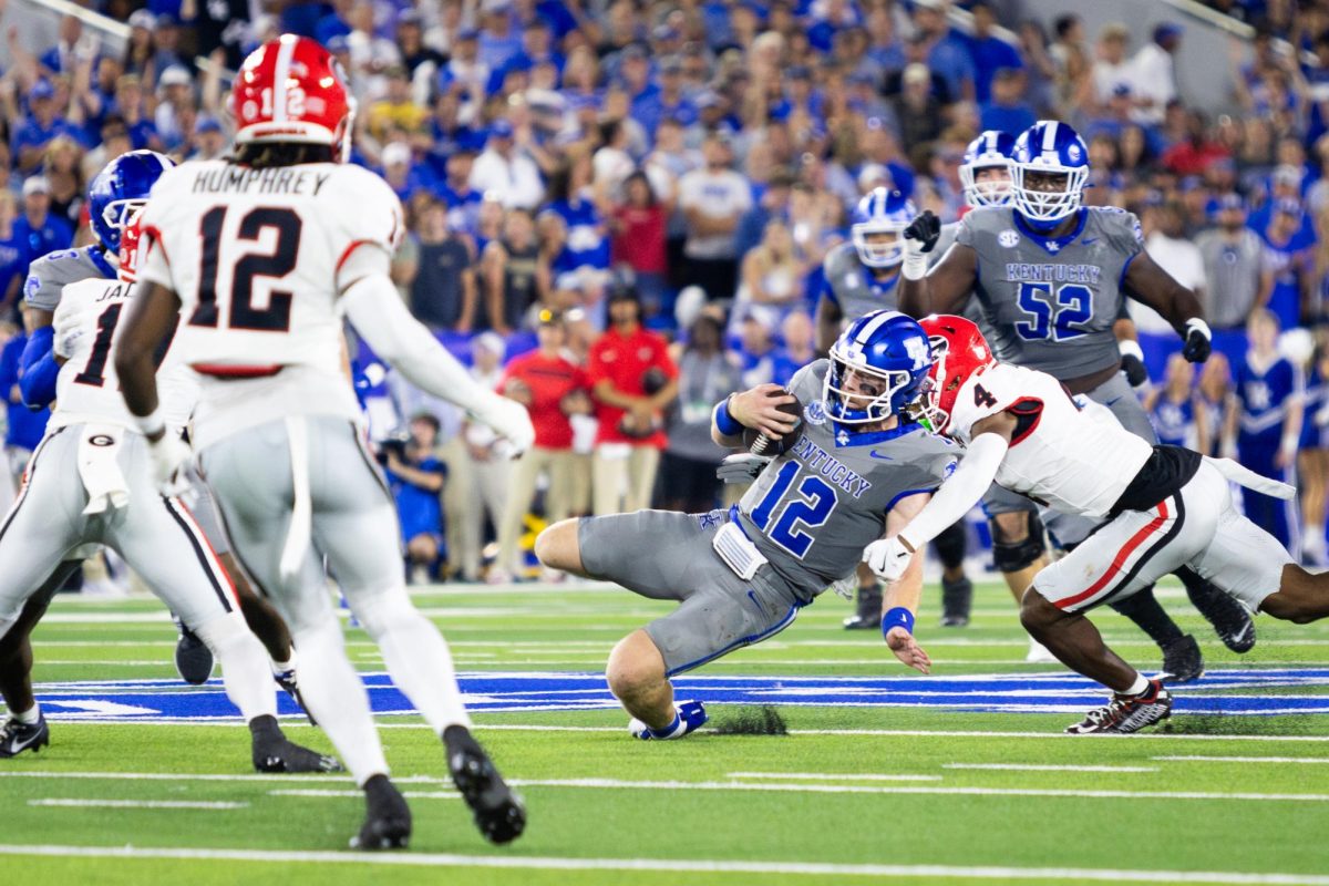 Kentucky quarterback Brock Vandagriff (12) slides with the ball during the Kentucky vs. No. 1 Georgia football game on Saturday, Sept. 14, 2024, at Kroger Field in Lexington, Kentucky. Photo by Samuel Colmar | Staff