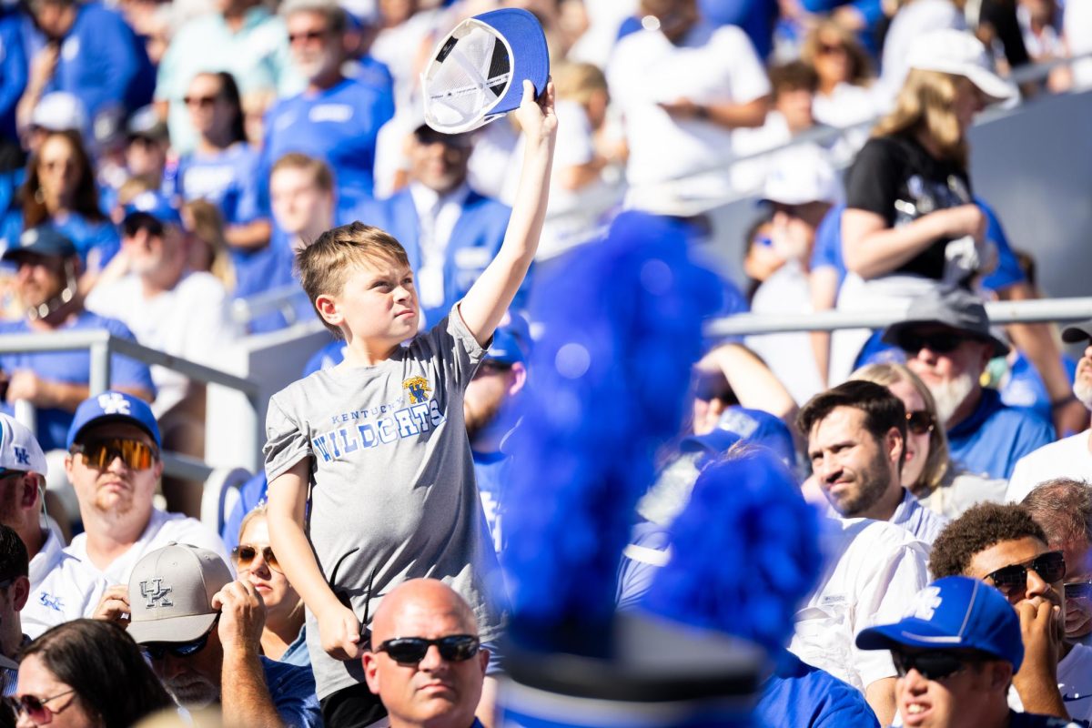 A Kentucky fan waves his hat during the Kentucky vs. South Carolina football game on Saturday, Sept. 7, 2024, at Kroger Field in Lexington, Kentucky. Kentucky lost 31-6. Photo by Samuel Colmar | Staff