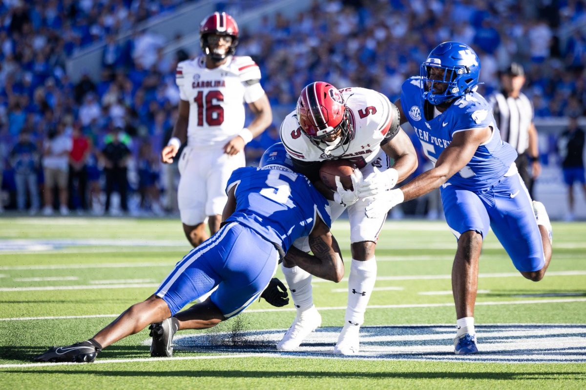 Kentucky players attempt to tackle South Carolina running back Raheim Sanders (5) during the Kentucky vs. South Carolina football game on Saturday, Sept. 7, 2024, at Kroger Field in Lexington, Kentucky. Kentucky lost 31-6. Photo by Samuel Colmar | Staff