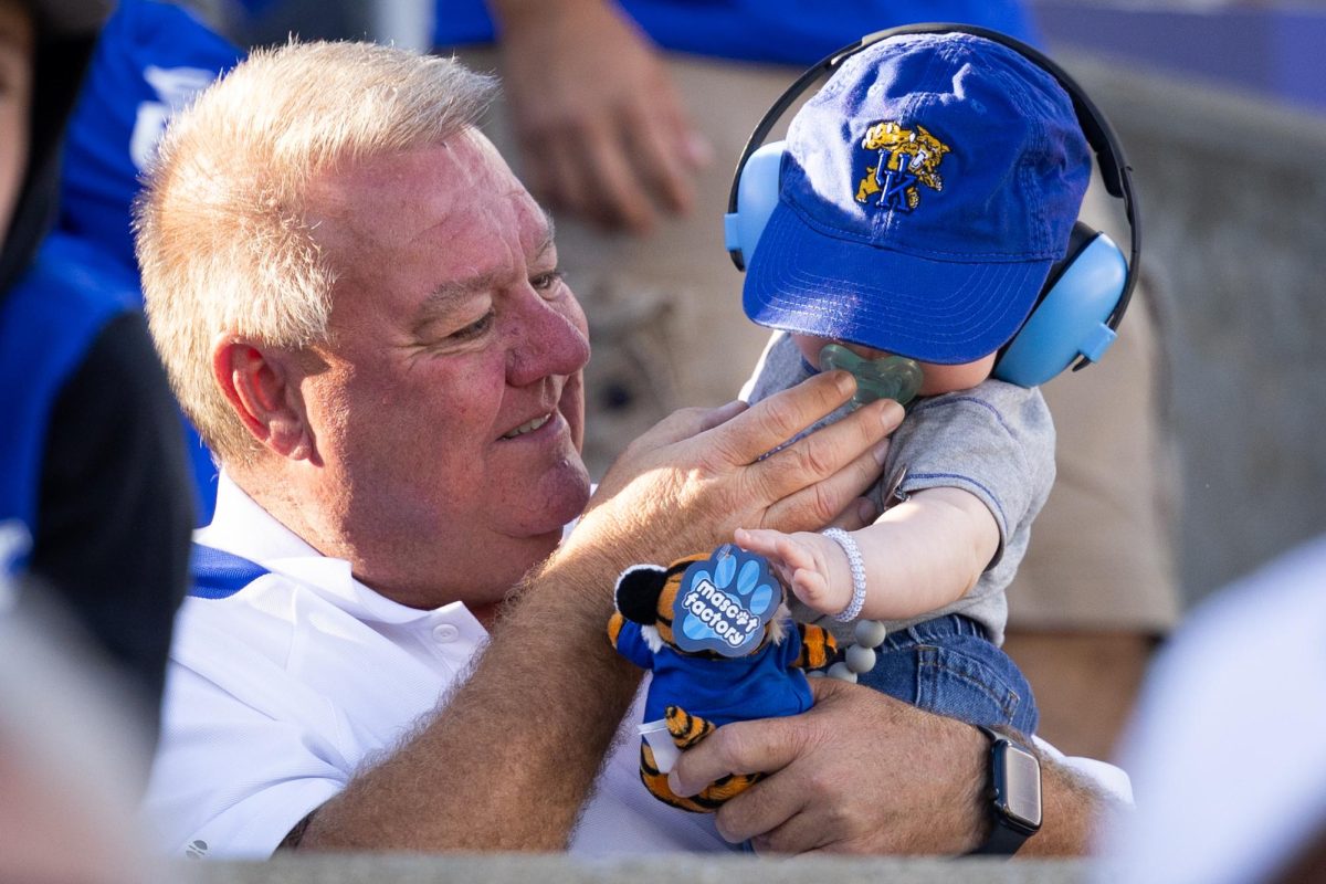 A fan puts a pacifier in a baby’s mouth during the Kentucky vs. South Carolina football game on Saturday, Sept. 7, 2024, at Kroger Field in Lexington, Kentucky. Kentucky lost 31-6. Photo by Samuel Colmar | Staff