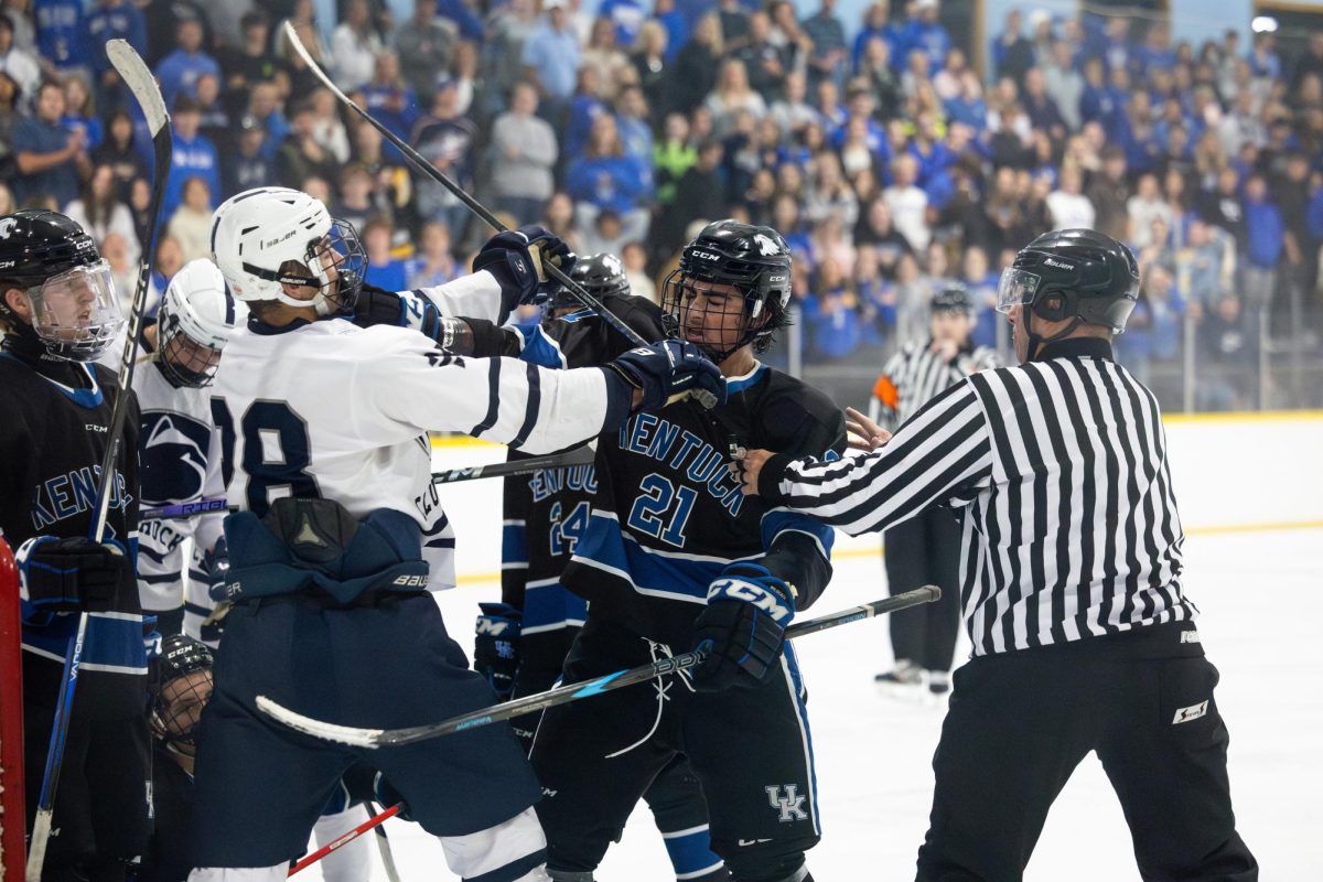 Kentucky winger Nick Delaney (21)fights with a Penn State player during the Kentucky vs. Penn State hockey match on Saturday, Sept. 14, 2024, at the Lexington Ice and Recreation Center in Lexington, Kentucky. Kentucky won 4-1. Photo by Samuel Colmar | Staff