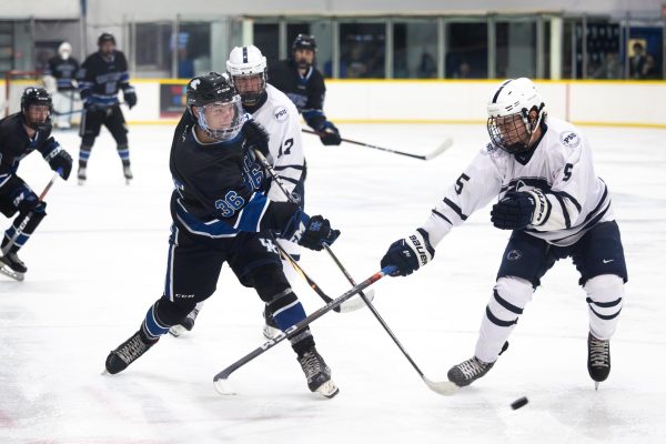 Kentucky forward Alex Clingerman (36) hits the puck during the Kentucky vs. Penn State hockey match on Saturday, Sept. 14, 2024, at the Lexington Ice and Recreation Center in Lexington, Kentucky. Kentucky won 4-1. Photo by Samuel Colmar | Staff