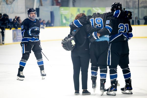 Kentucky winger Collin Costello (19) is helped off the rink during the Kentucky vs. Penn State hockey match on Saturday, Sept. 14, 2024, at the Lexington Ice and Recreation Center in Lexington, Kentucky. Kentucky won 4-1. Photo by Samuel Colmar | Staff