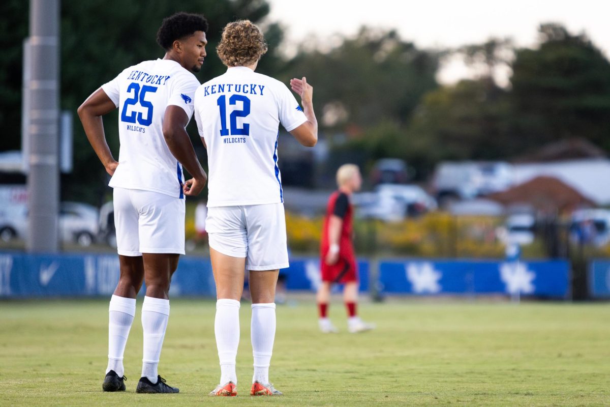 Kentucky forward Isaiah Chisolm (25), left, speaks with forward Logan Dorsey (12) between play during the No. 16 Kentucky vs. 15. Louisville men’s soccer match on Monday, Sept. 9, 2024, at the Wendell and Vickie Bell Soccer Complex in Lexington, Kentucky. Kentucky lost 1-0. Photo by Samuel Colmar | Staff