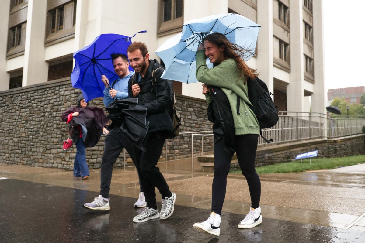 Students walk through Category 4 Hurricane Helene to get to class on Friday, Sept. 27, 2024, at the University of Kentucky in Lexington, Kentucky. Photo by Abbey Cutrer | Staff